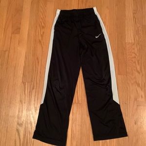 Black and white Nike dri-fit sweatpants. Adult large size. Good condition